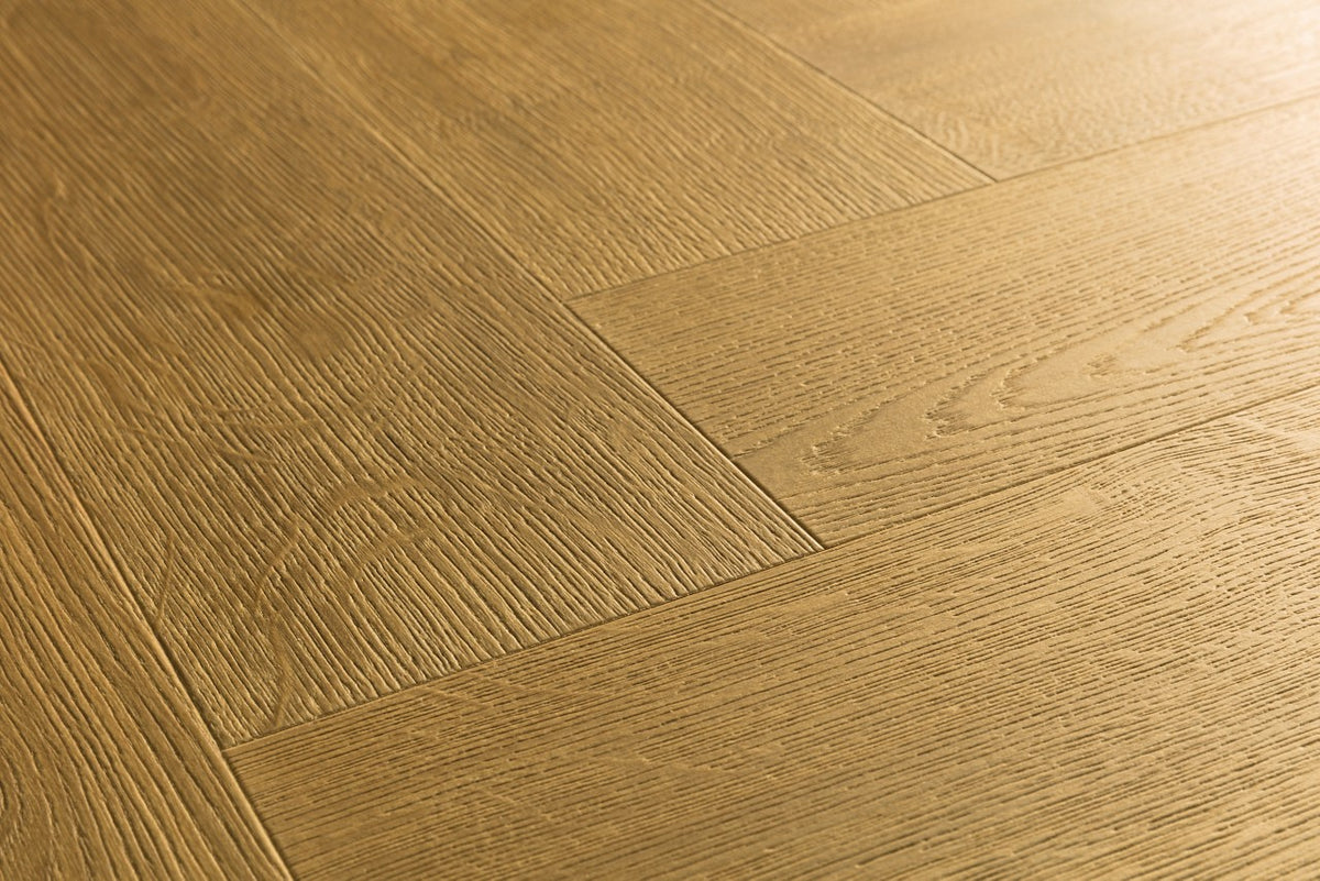 Textura de la superficie del suelo laminado Quick-Step Impressive Design Roble Canela