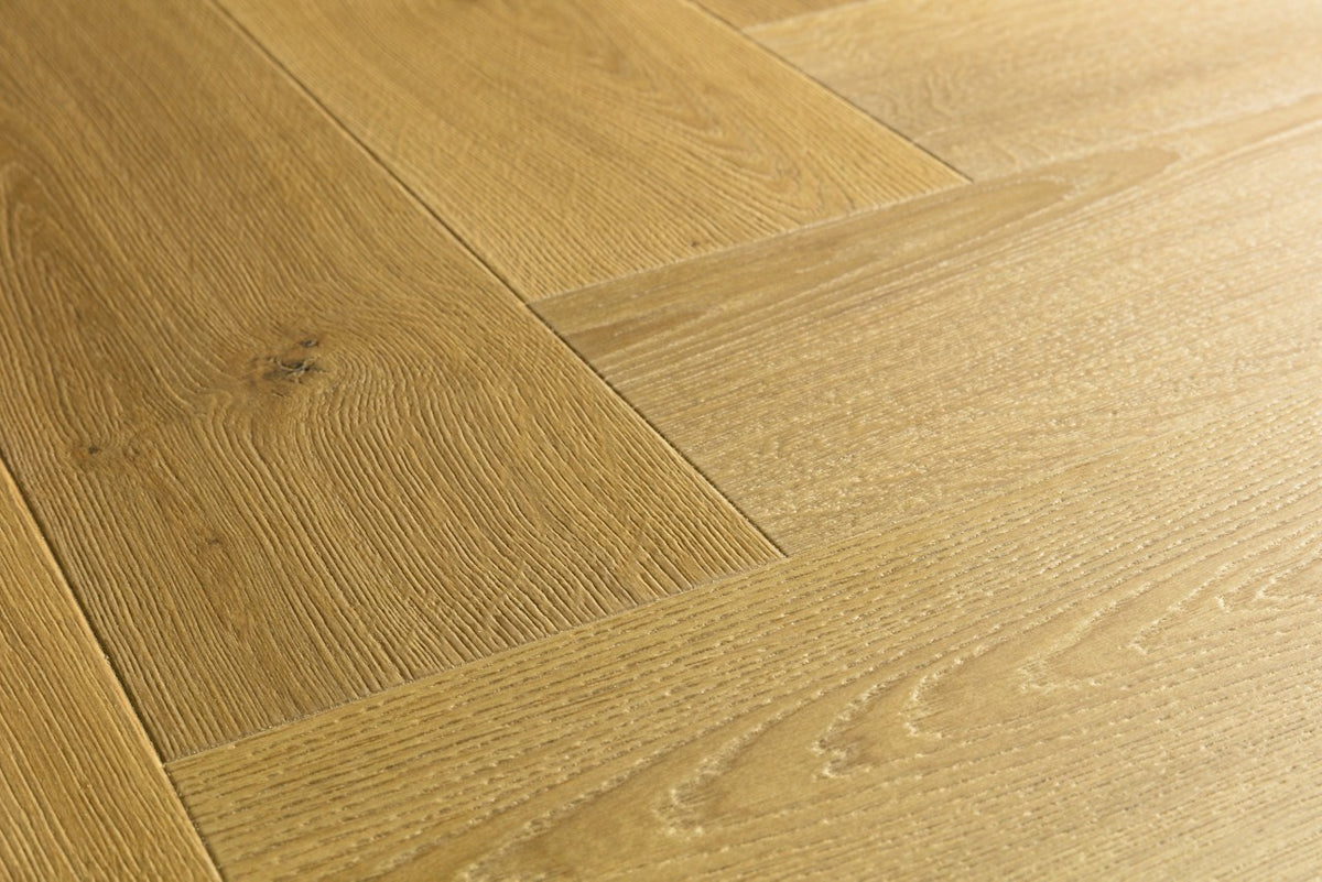 Textura de la superficie del suelo laminado Quick-Step Impressive Design Roble Comino